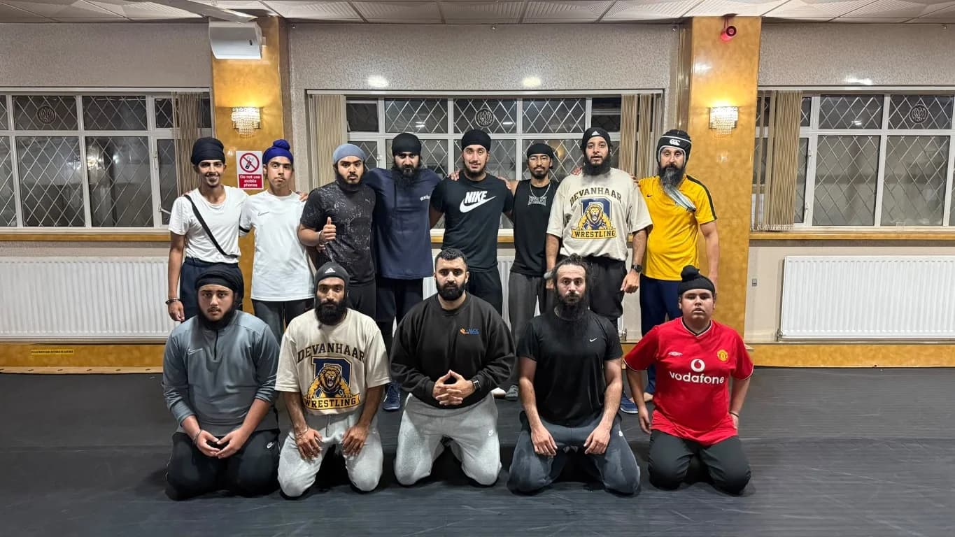 Academy wrestlers posing together after training