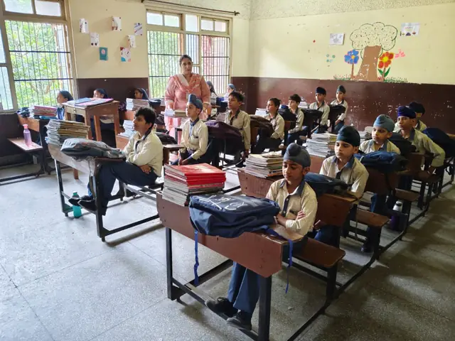 Pupils learning in a classroom at the partner school