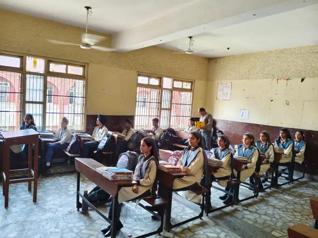 Pupils attending a lesson in a classroom